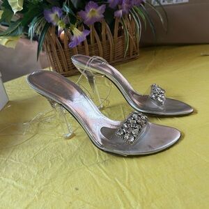 Stuart Weitzman silver heels.